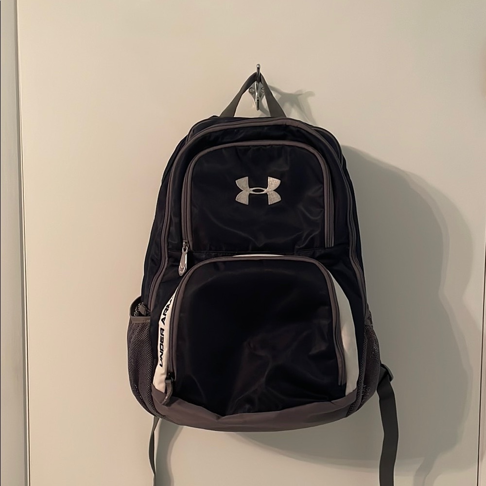 Under Armour Navy Blue with Grey Backpack.  Orange interior.